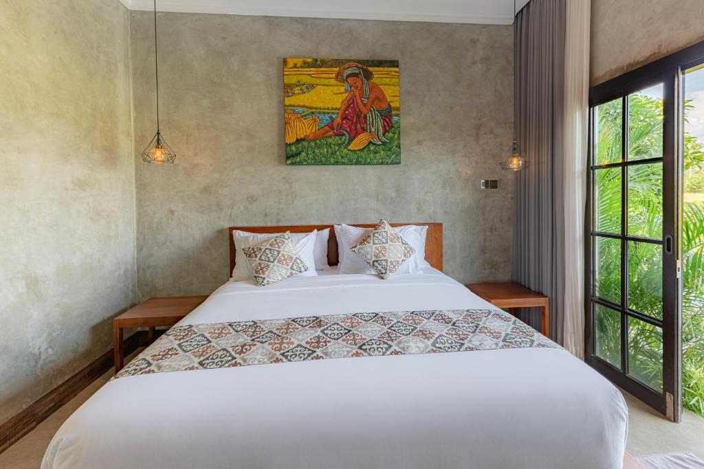 Postel nebo postele na pokoji v ubytování VILLARIZ Ubud , Bali