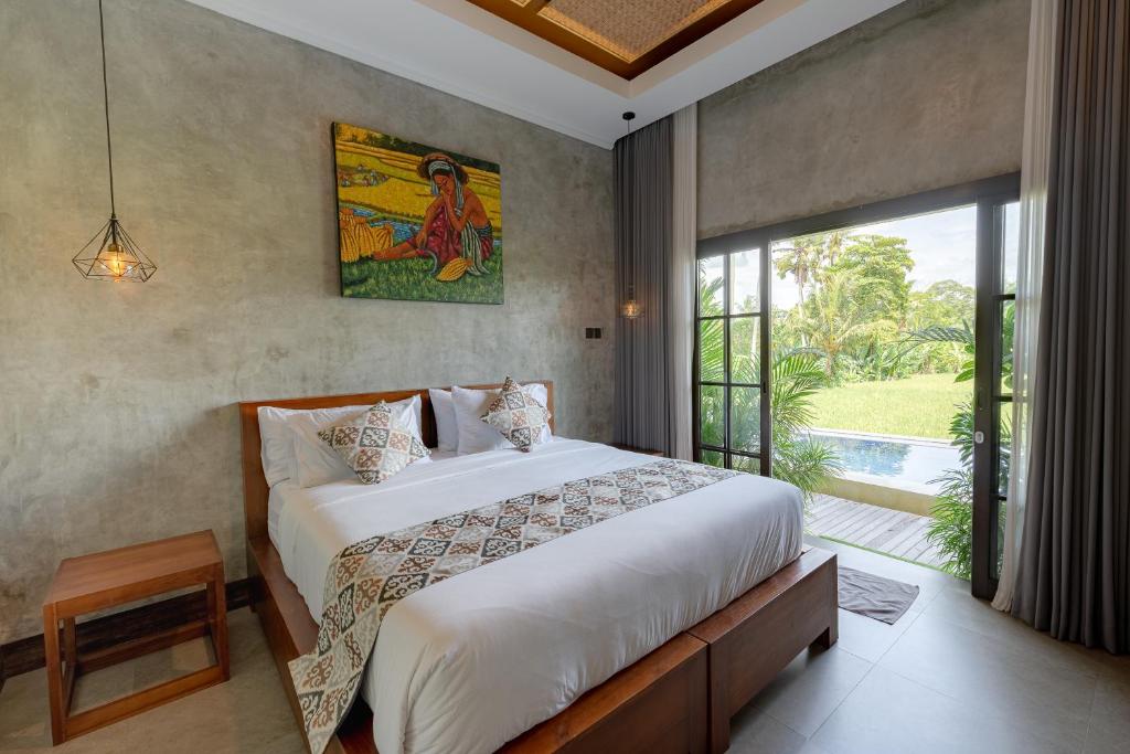 Postel nebo postele na pokoji v ubytování VILLARIZ Ubud , Bali
