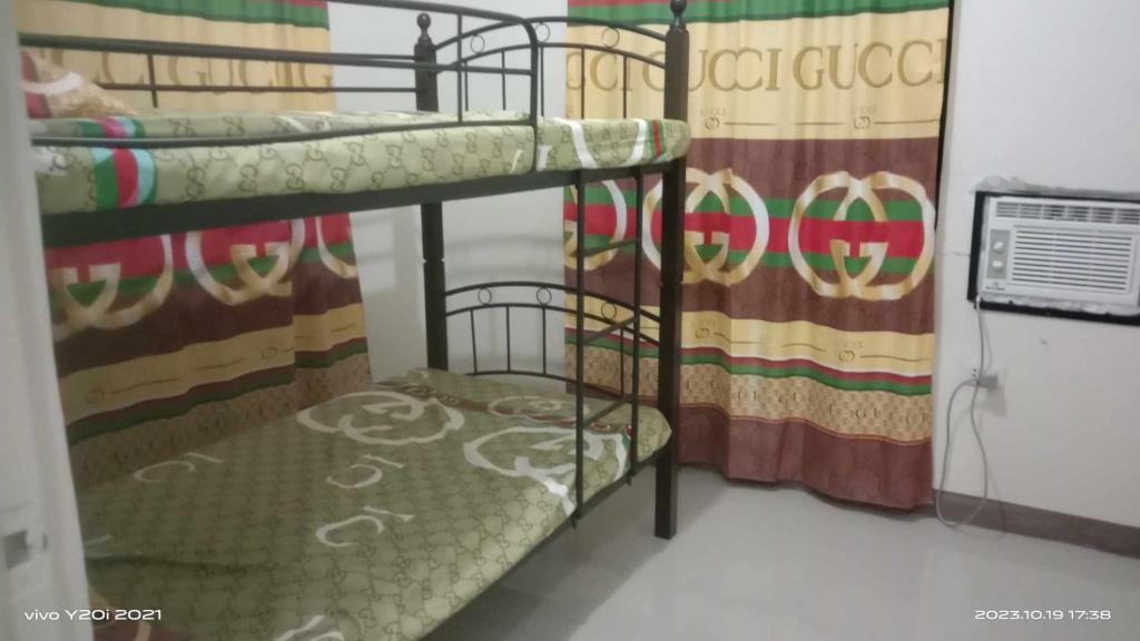 a couple of bunk beds in a room at Espina/Salazar in Batangas City
