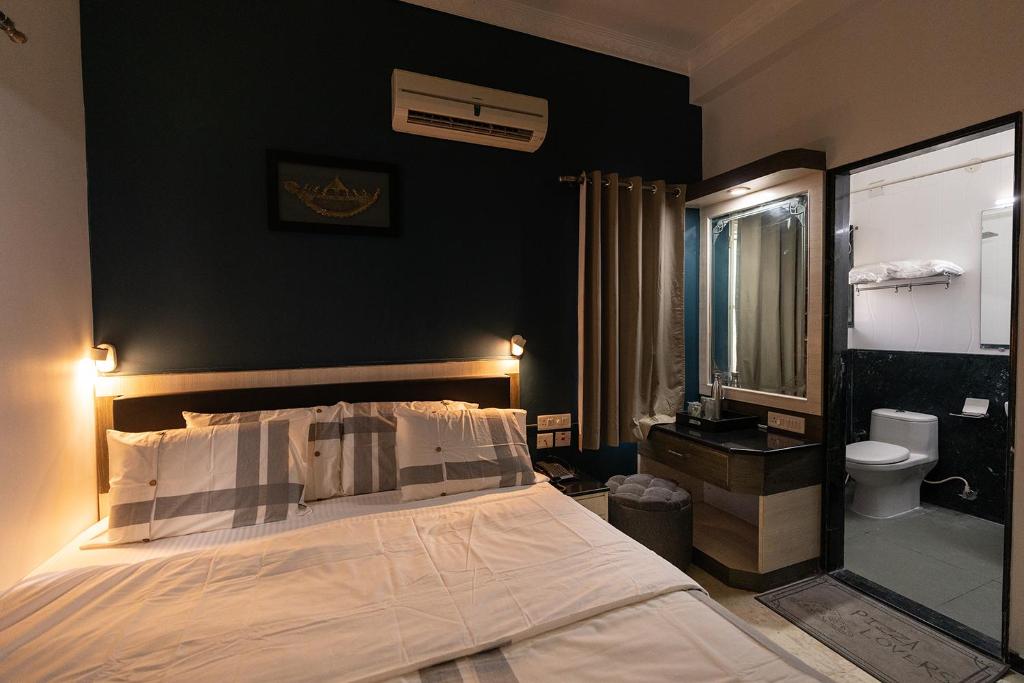 Postel nebo postele na pokoji v ubytování Hive Service Apartment