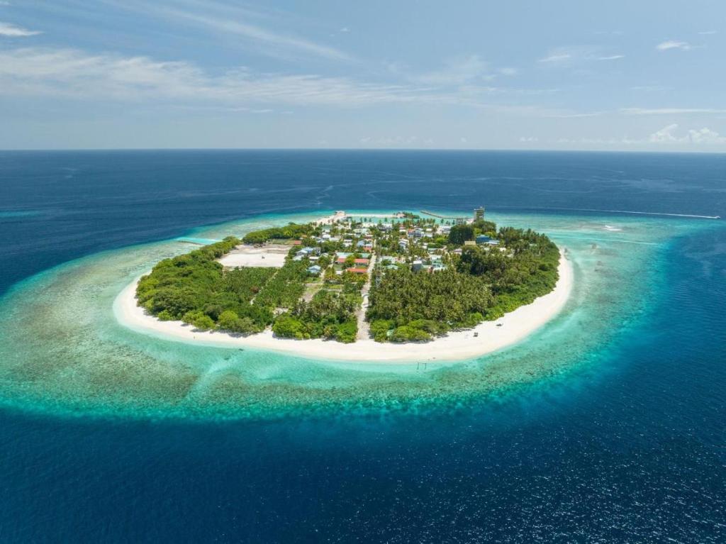 an island in the middle of the ocean at Hanifaru Beach Inn in Baa Atoll