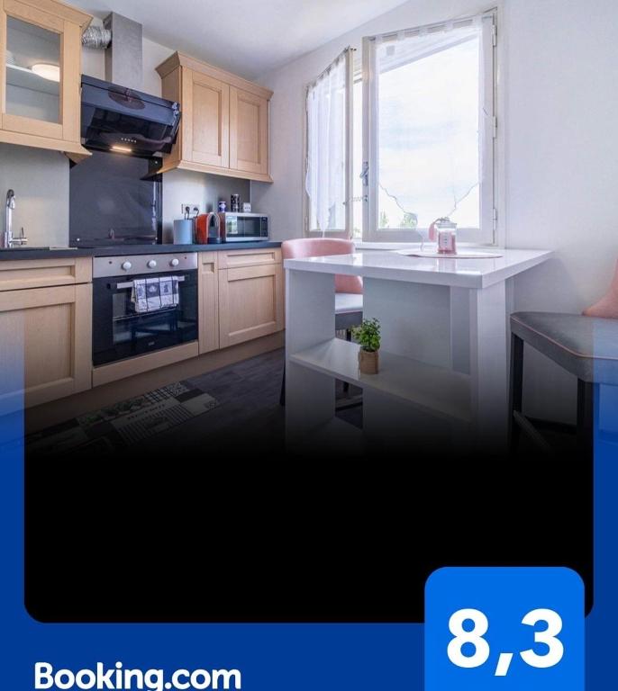 Kuchyňa alebo kuchynka v ubytovaní Place privée/Le Marbré/Moderne/60m2