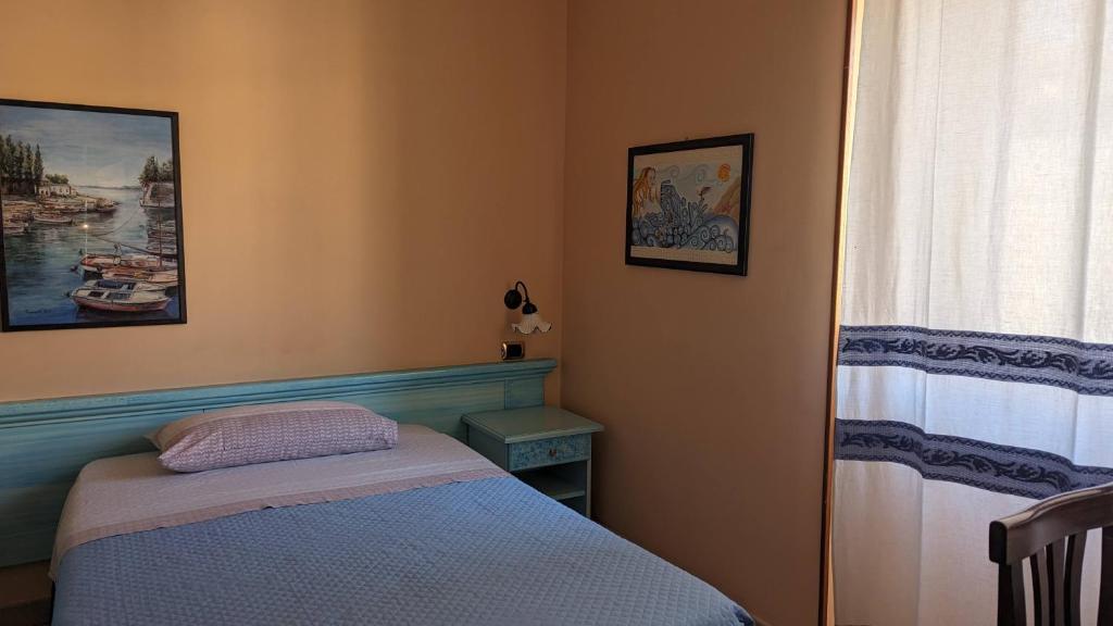 Postel nebo postele na pokoji v ubytování Hotel Aquarius