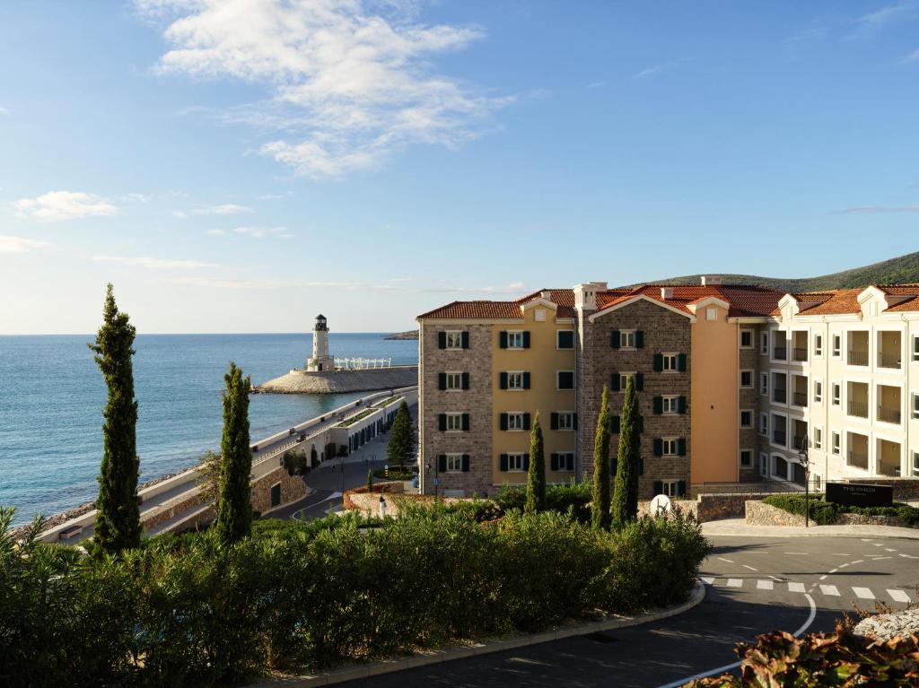 a view of a building and the ocean at The Chedi Luštica Bay in Tivat