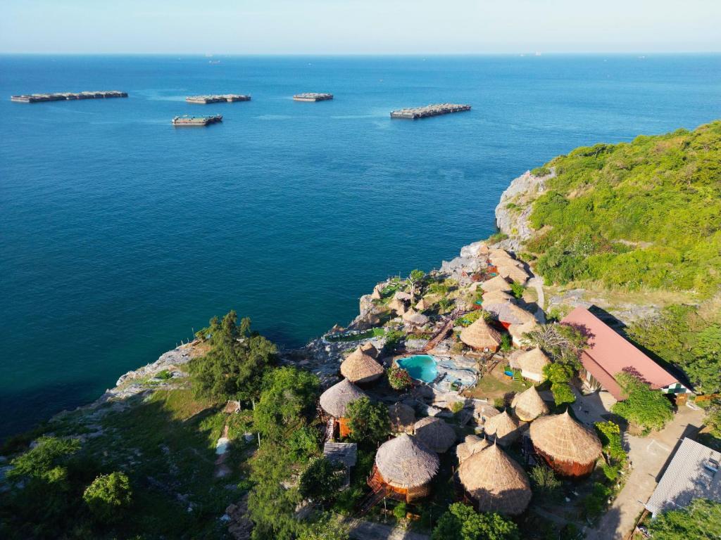 an aerial view of the ocean with a group at Pareehut Resort Koh Sichang in Ko Si Chang