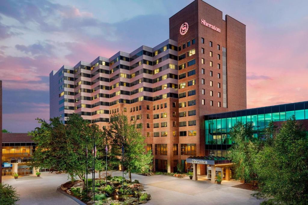 a large building with a clock on top of it at Sheraton Baltimore North in Towson