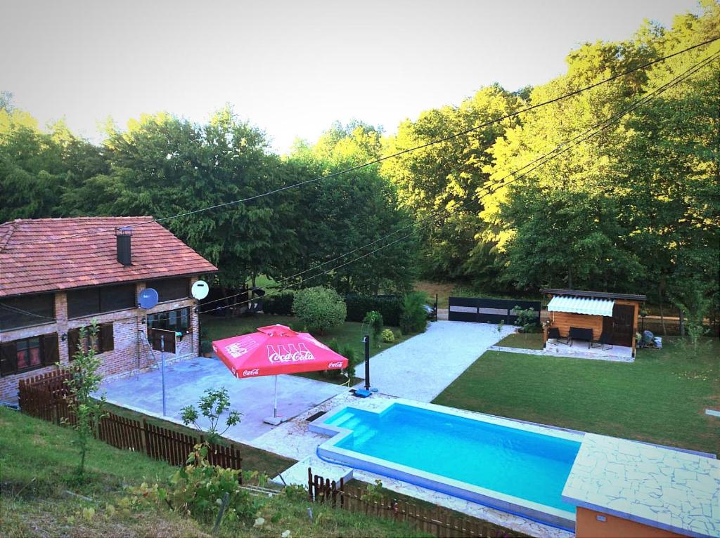 an overhead view of a swimming pool in a backyard at Villa FORESTA in Banja Luka