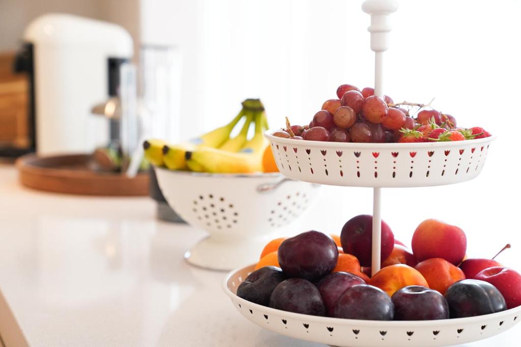 two bowls of fruit sitting on a counter top at Canal view 3 bedroom holiday home with balcony in Abu Dhabi