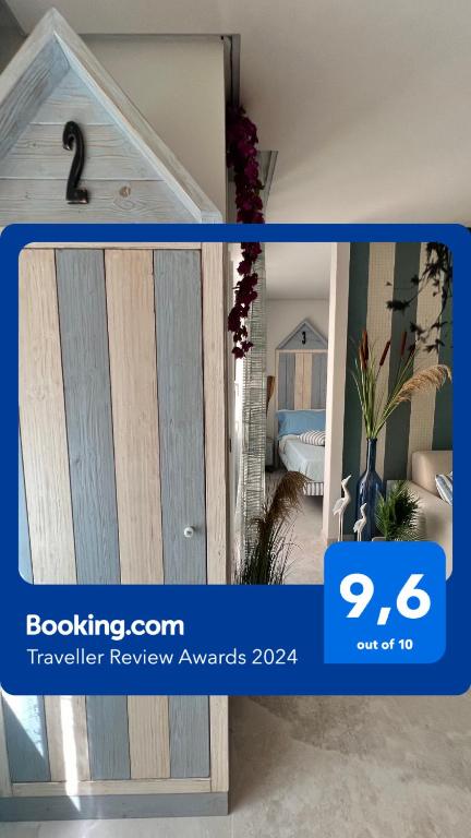 a sliding door in a room with a bedroom at beach house in Chioggia