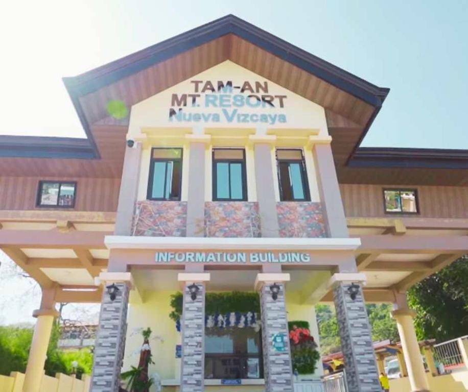 a building with a sign that reads i am an mt resort unionweapon at TAM-AN MOUNTAIN RESORT & HOTEL in Bayombong