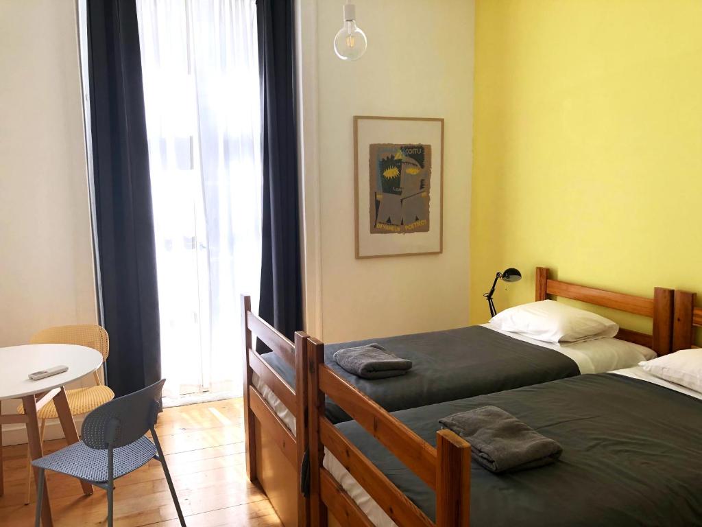 Postel nebo postele na pokoji v ubytování Living Lounge Hostel