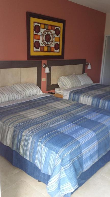 Postel nebo postele na pokoji v ubytování Dreams Hotel Puerto Rico