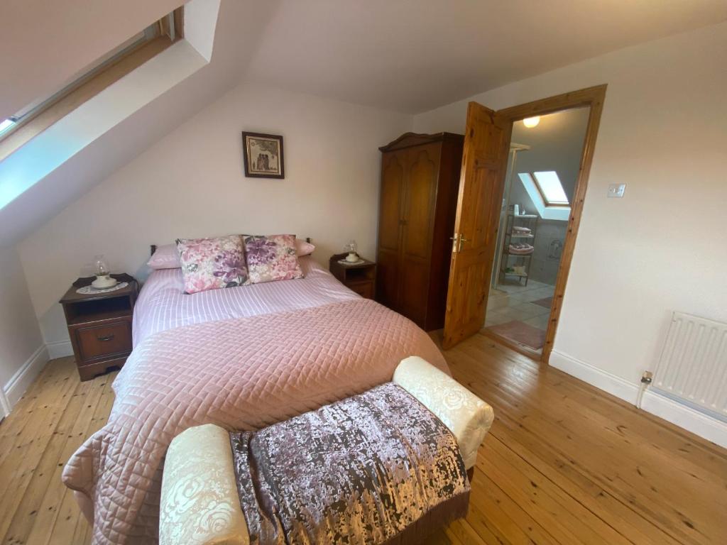 a bedroom with a bed and a couch at The Hazel Tree BnB 