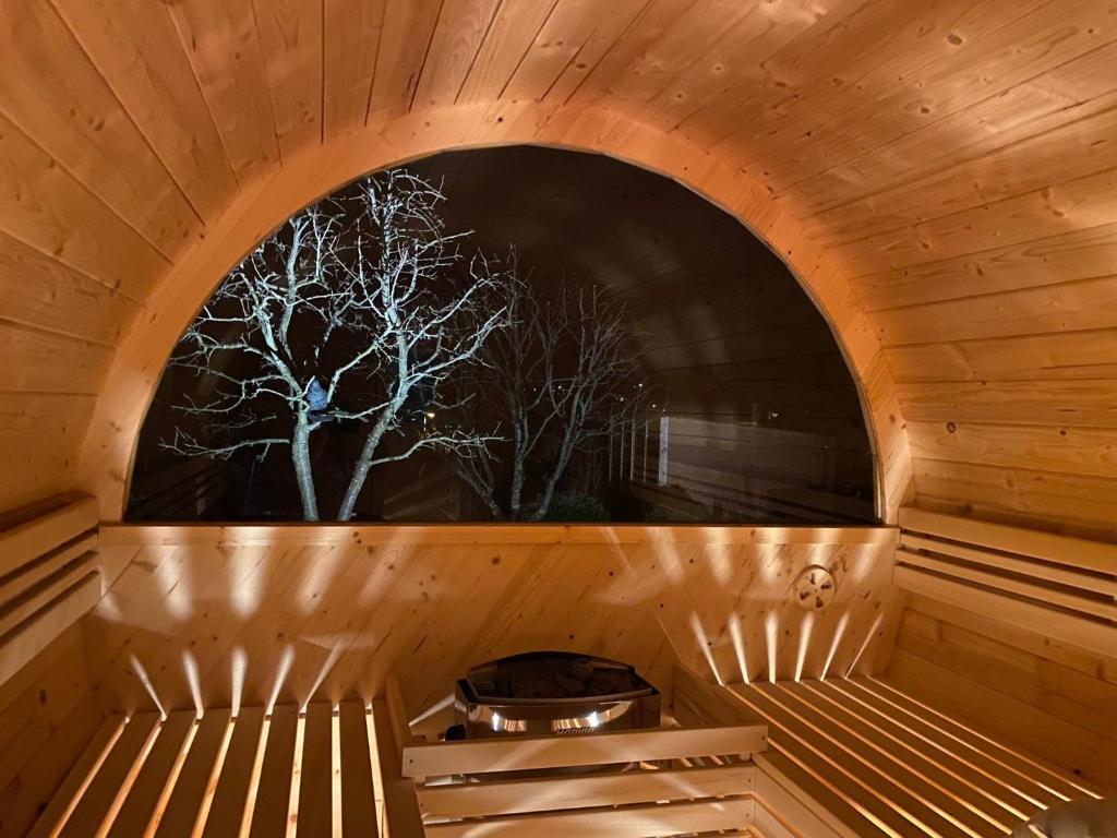 a sauna with a tree in the window at Ferienwohnung mit Blick auf den "Kickelhahn" in Ilmenau