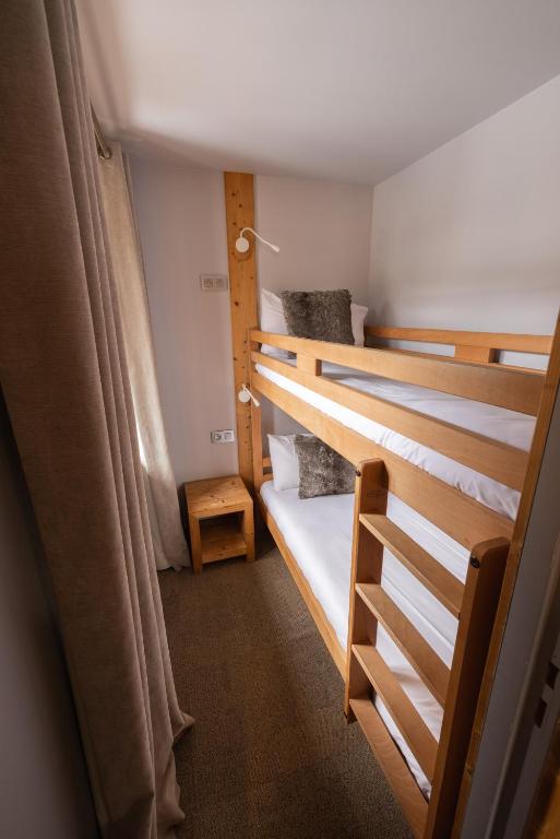 Postel nebo postele na pokoji v ubytování Hôtel et Spa les Clarines