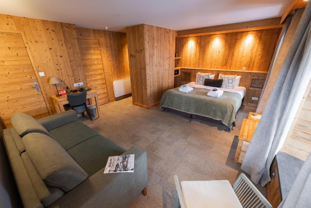 Postel nebo postele na pokoji v ubytování Hôtel et Spa les Clarines
