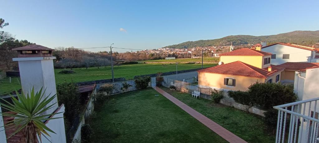 a view from the balcony of a house with a yard at Torre de Santiago - Guest House in Vila Praia de Âncora