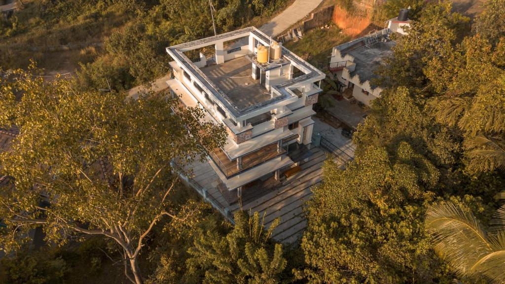 an overhead view of a house in the trees at Padma Bliss Guest House in Mangalore