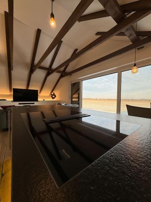 a pool table in a room with a view of the desert at Juwel am Stadtrand von Wien in Korneuburg