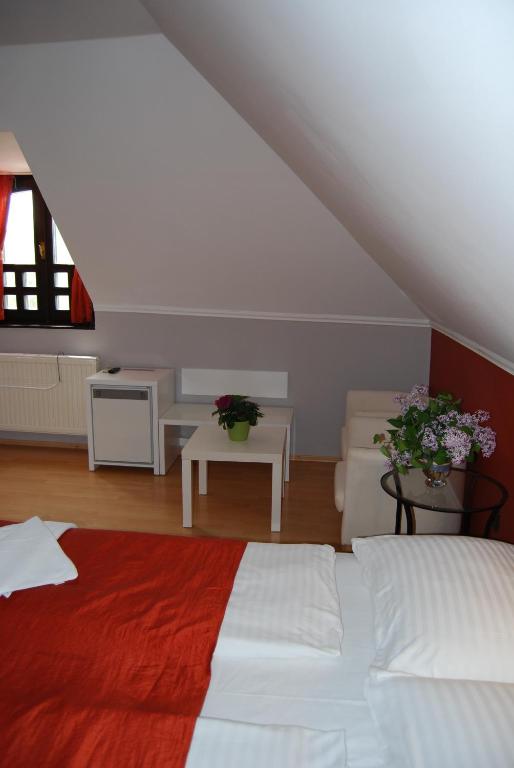 Postel nebo postele na pokoji v ubytování Adler Hotel & Wellness