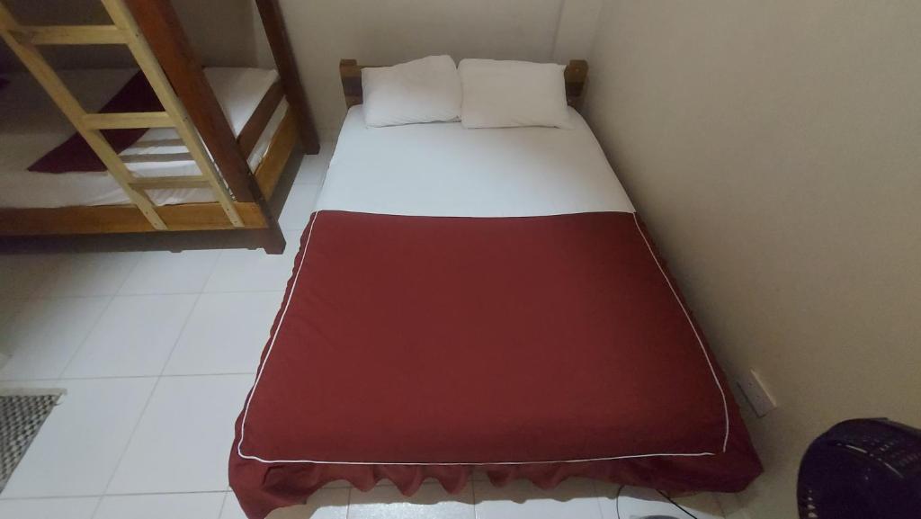 Postel nebo postele na pokoji v ubytování La Jangada Hostel & Tours