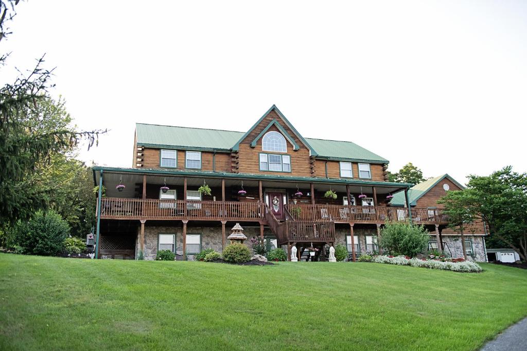 a large house with a large lawn in front of it at Berry Patch BnB in Lebanon