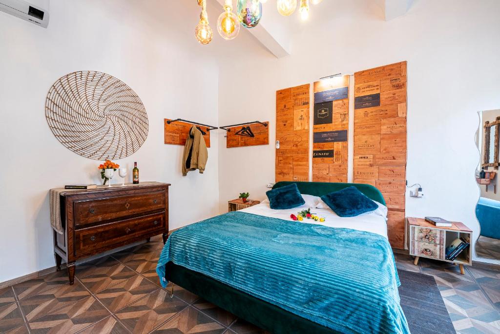 Posteľ alebo postele v izbe v ubytovaní Borgognissanti Suites