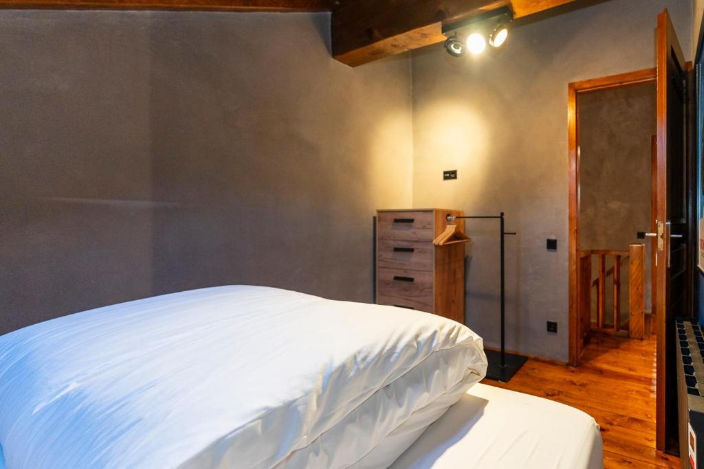 Postel nebo postele na pokoji v ubytování Pleta del Tarter Lodge