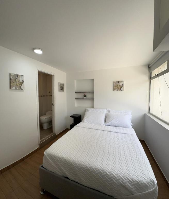 Postel nebo postele na pokoji v ubytování HOSTELFC CORFERIAS