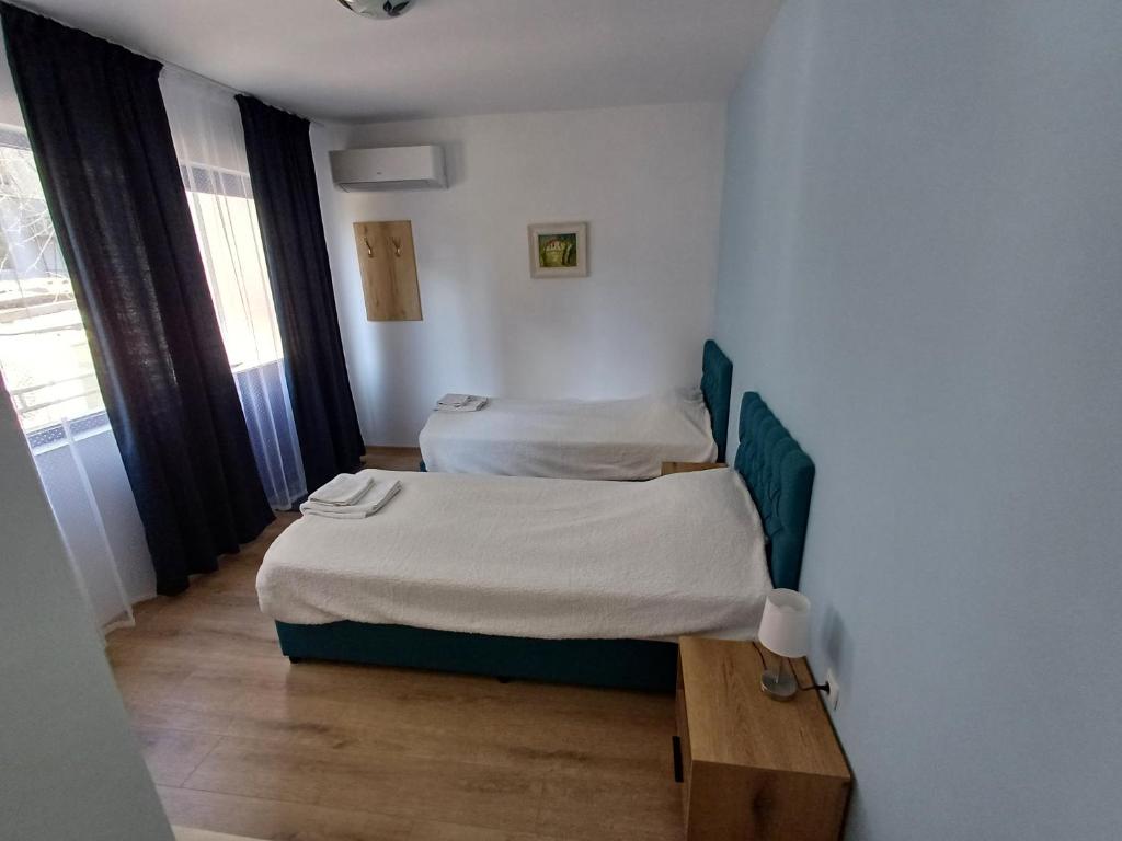 Postel nebo postele na pokoji v ubytování Fenix Family Hotel