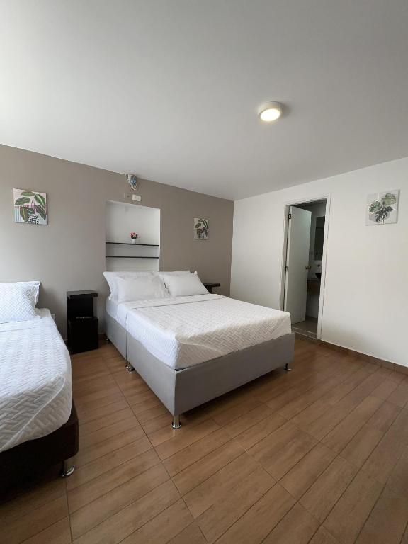 Postel nebo postele na pokoji v ubytování HOSTELFC CORFERIAS