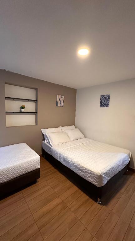Postel nebo postele na pokoji v ubytování HOSTELFC CORFERIAS