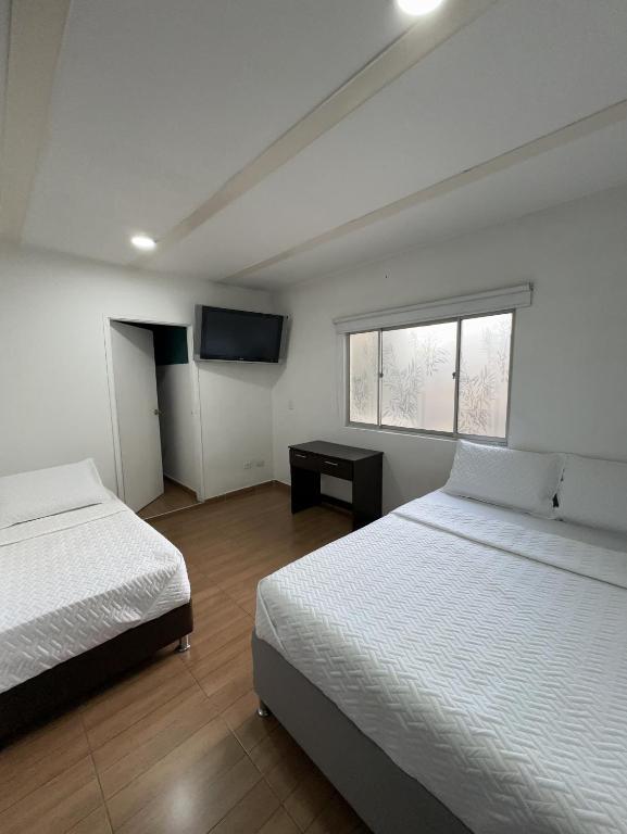 Postel nebo postele na pokoji v ubytování HOSTELFC CORFERIAS