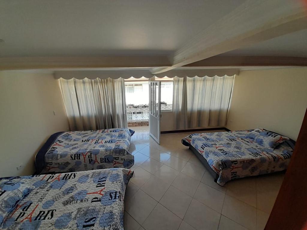 מיטה או מיטות בחדר ב-Casa de Ensueño en Filandia: Tu Hogar Lejos de Casa