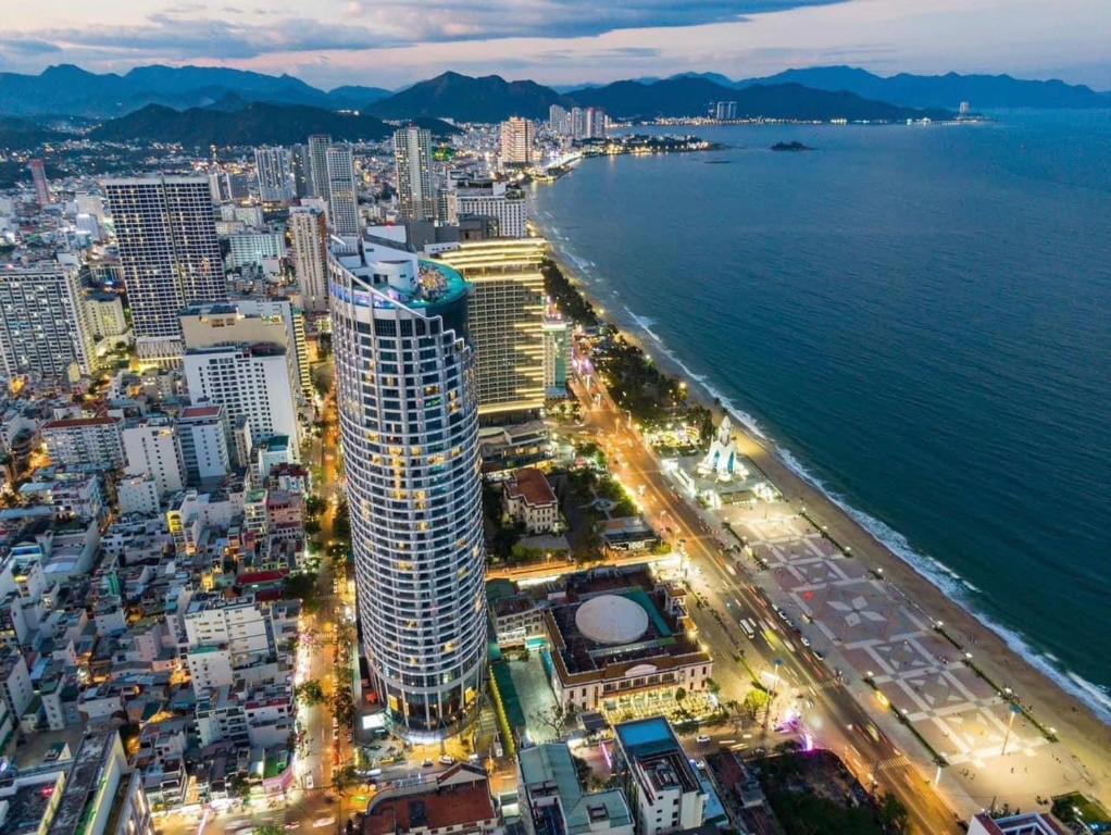 an aerial view of a city next to the ocean at OCEANFRONT PANORAMA RESIDENCE in Nha Trang