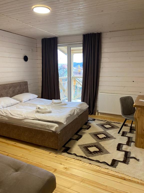 Postel nebo postele na pokoji v ubytování Chalet Ivanna