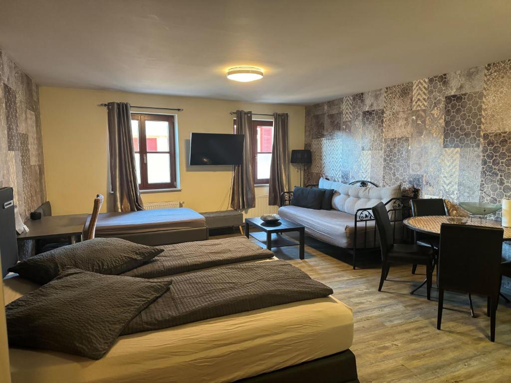 Postel nebo postele na pokoji v ubytování Hotel Mythos "Apartments"