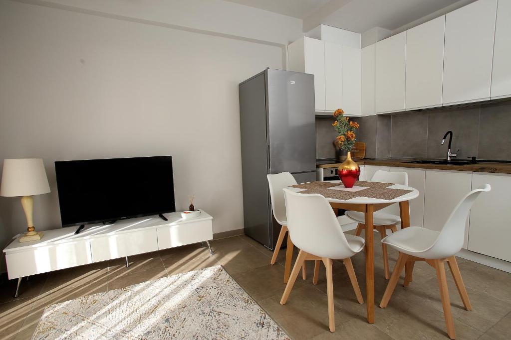TV a/nebo společenská místnost v ubytování NOVA Sea View Apartments