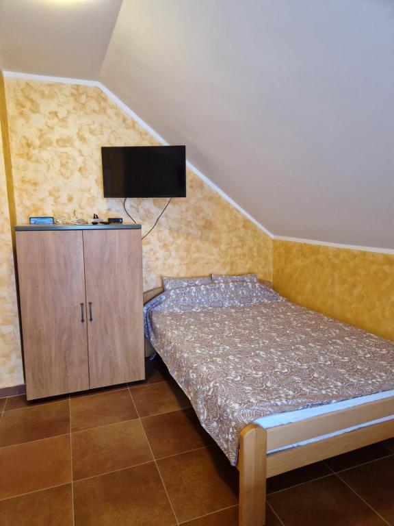 Postel nebo postele na pokoji v ubytování Apartmani Tina - Srebrno jezero