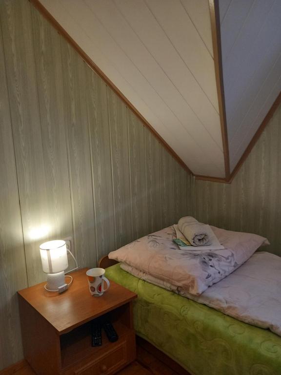 Postel nebo postele na pokoji v ubytování Agroturystyka Pod Złotą Wiechą