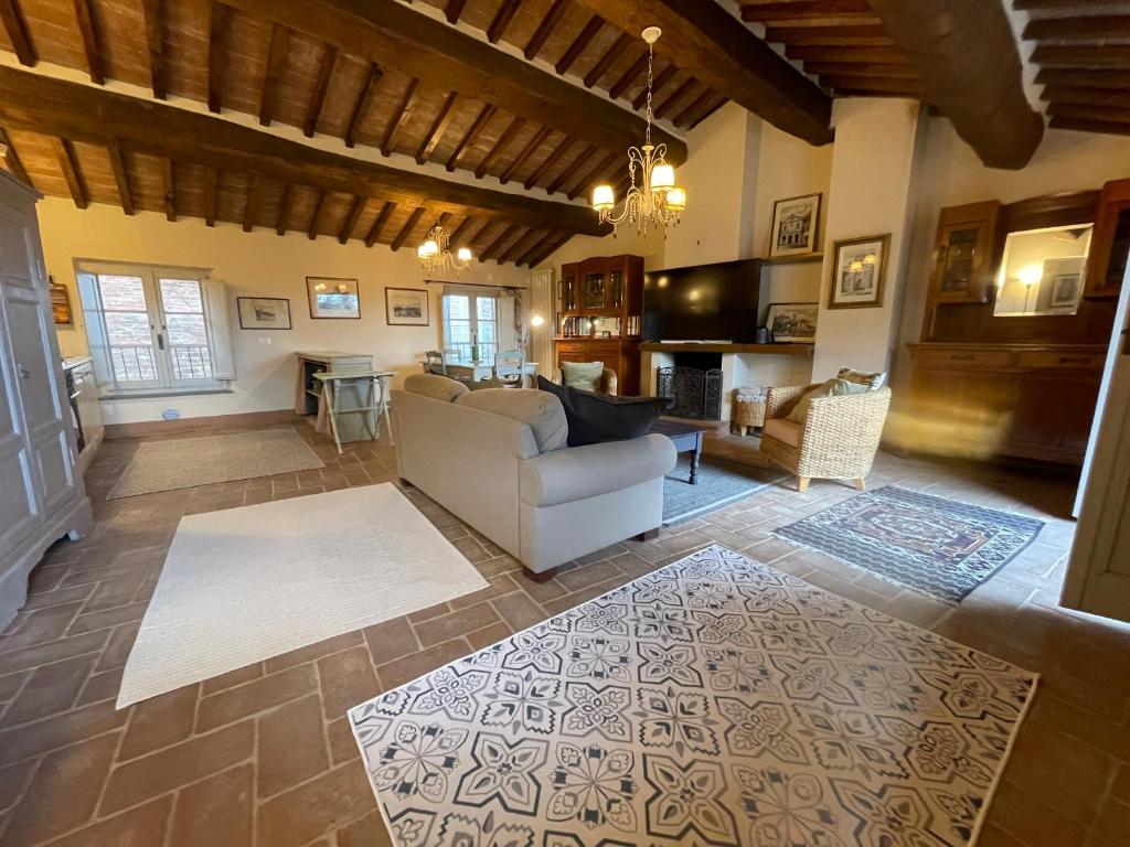 a living room with a couch and a table at 2 King Bed, 2 Full Bathroom Apartment in Umbria - Tuscany in Città della Pieve
