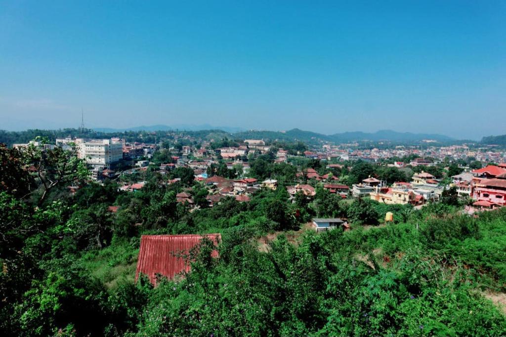 a view of a city from the top of a hill at Coorg nest Home stay in Madikeri