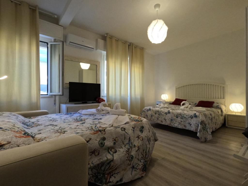 A bed or beds in a room at Il Merlo