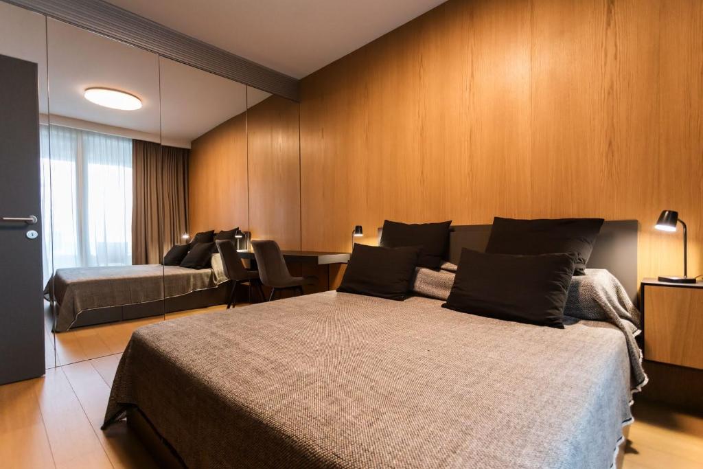 Кровать или кровати в номере Sky Park Residence