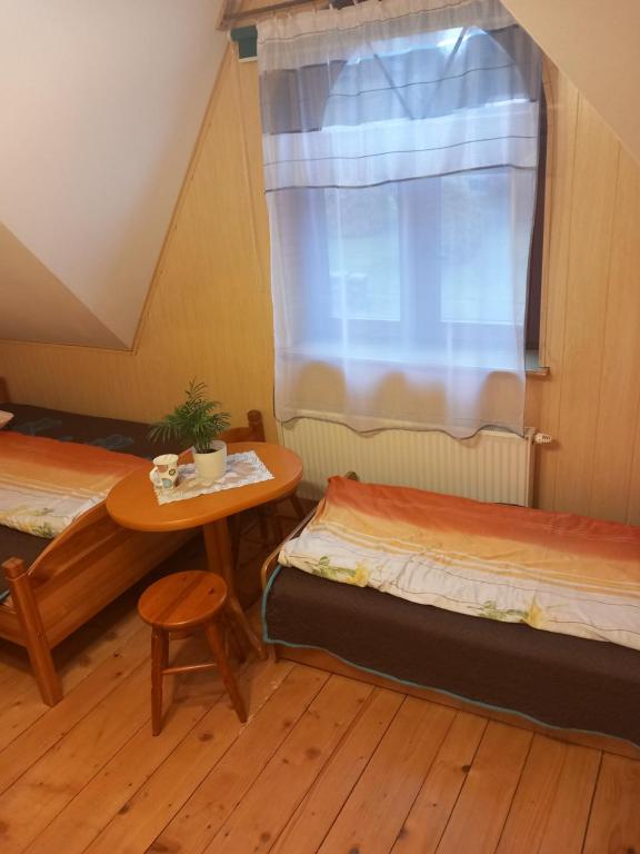 Postel nebo postele na pokoji v ubytování Agroturystyka Pod Złotą Wiechą
