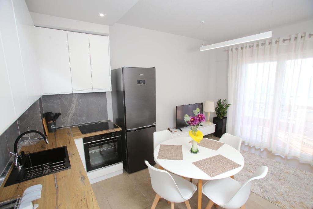 TV a/nebo společenská místnost v ubytování NOVA Sea View Apartments
