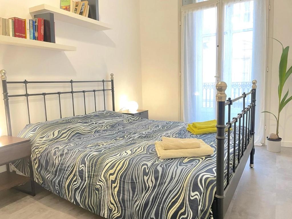 a bedroom with a bed with a zebra print sheets at Anselmo Max in Turin