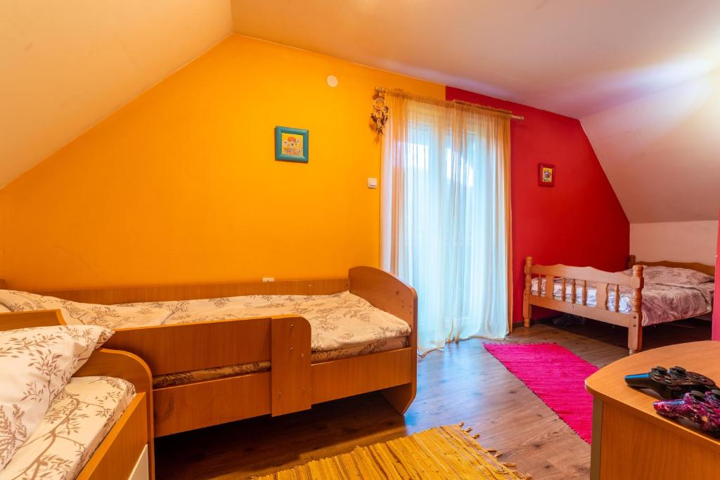 Postel nebo postele na pokoji v ubytování Vila Kristina