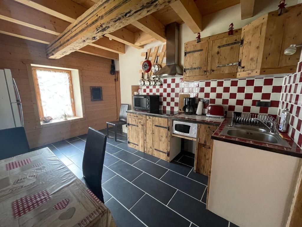 a kitchen with a sink and a counter top at L’appart du centre in Le Biot