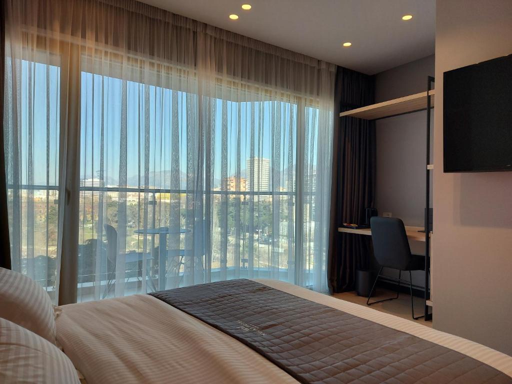 Una cama o camas en una habitación de Mulaj Hotel
